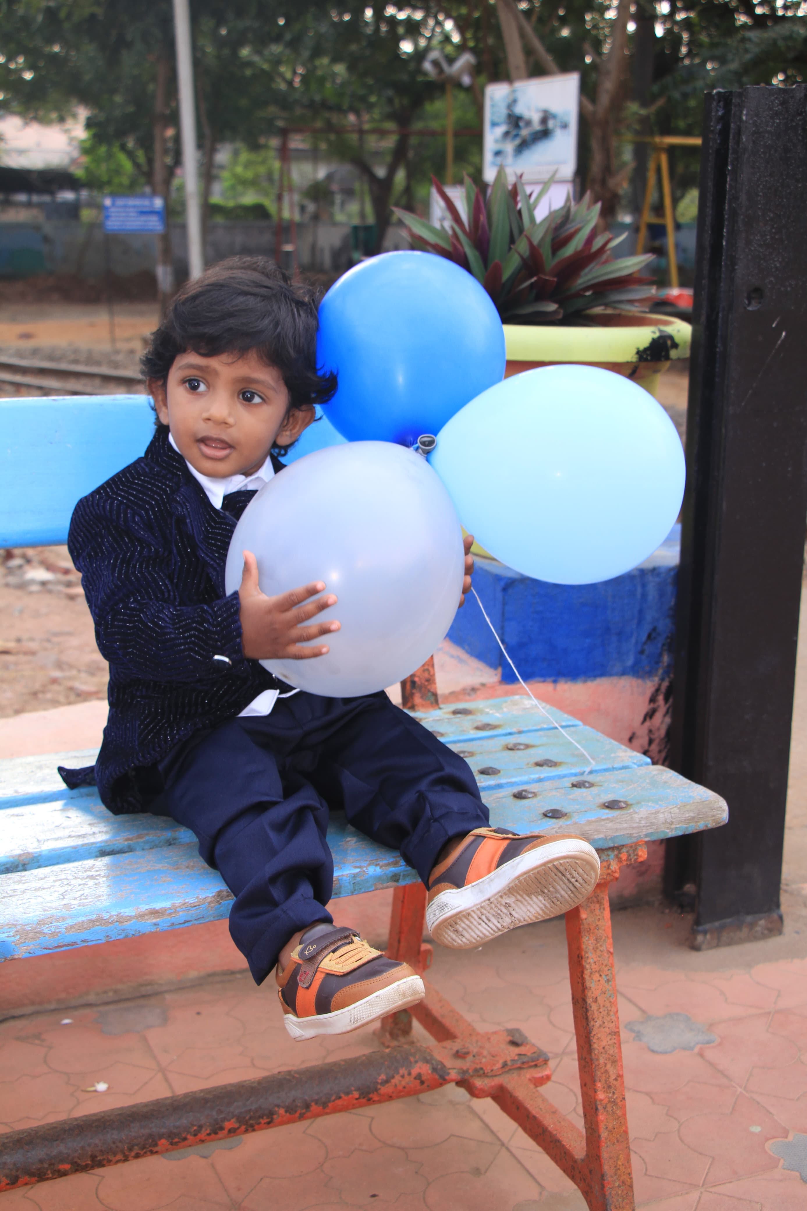 Baby with a teddy bear during photoshoot